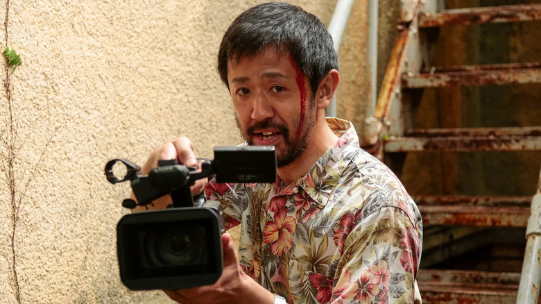 Takayuki Hamatsu as Takayuki Higurashi, holding a camera in One Cut of the Dead