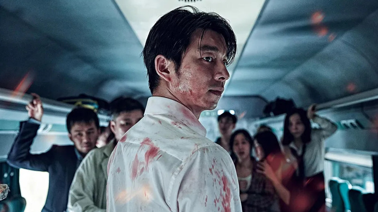 Gong Yoo as Seok-woo, looking over his shoulder in Train to Busan