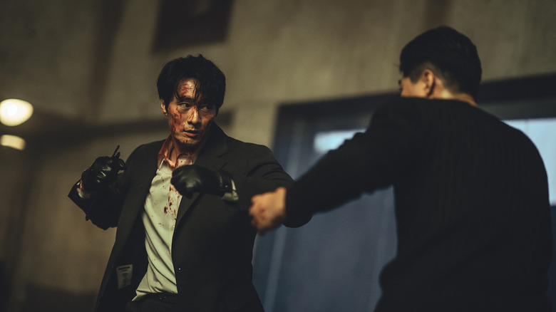 A bloody Nam Gi-jun (So Ji-sub) gets into a brutal fight in Mercy for None
