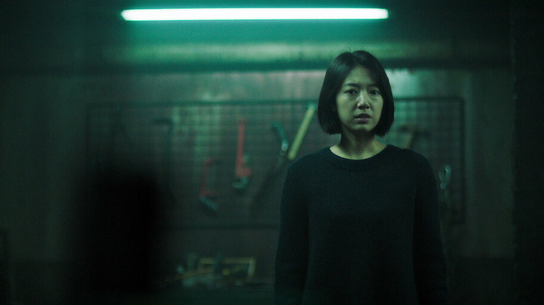 Oh Young-sook (Jeon Jong-seo) stands in a darkened basement in The Call