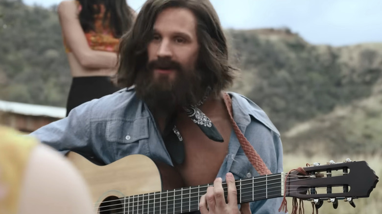 Charles Manson (Matt Smith) playing guitar in Charlie Says