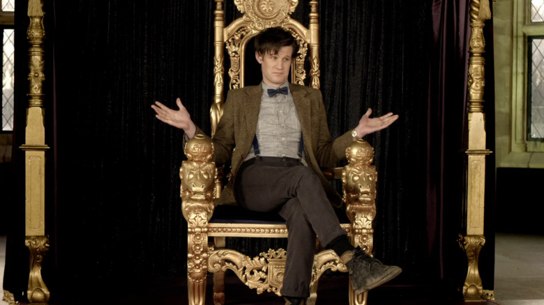 The Doctor (Matt Smith) shrugging on throne in Doctor Who