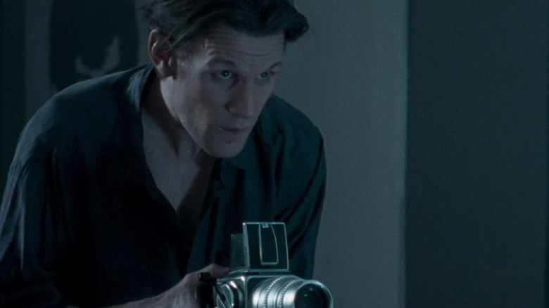 Mapplethorpe (Matt Smith) taking photo in Mapplethorpe