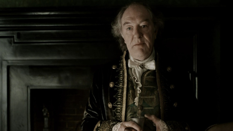 Michael Gambon as Baltus Van Tassel holding a cup in Sleepy Hollow