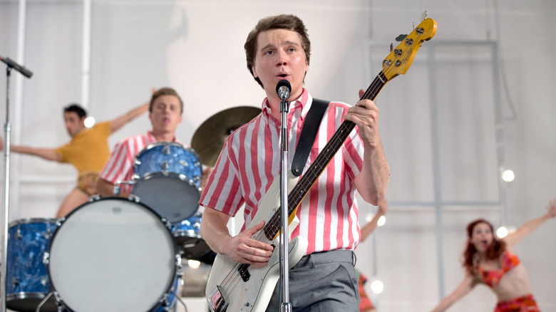 Paul Dano as Brian Wilson playing guitar and singing in the movie Love and Mercy