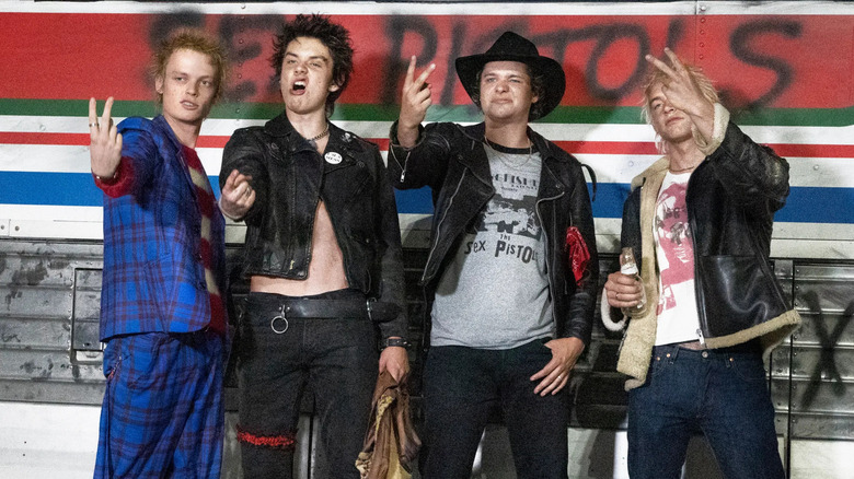 The cast of Pistol portraying the titular band at a concert in the FX docuseries