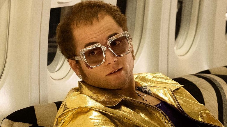 Taron Egerton as Elton John on a private jet in the movie Rocketman