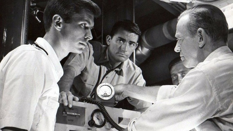 Commander Dwight and Lieutenant Commander Peter Holmes discuss the radiation levels in On the Beach