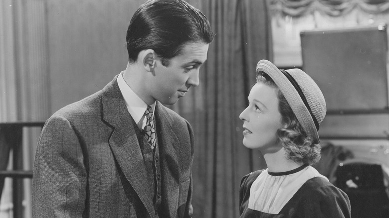 Alfred Kralik (James Stewart) smiles looking down at Klara Novak (Margaret Sullavan) in The Shop Around the Corner