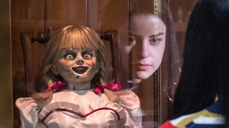 Katie Sarife's Daniela looking at Annabelle in Annabelle Comes Home