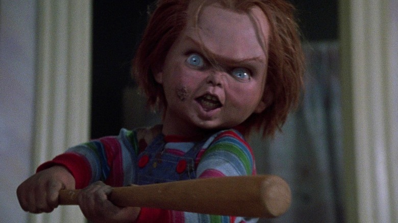 Chucky holding a baseball bat in Child's Play (1988)