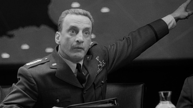 George C. Scott as General Buck Turgidson pointing in Dr. Strangelove