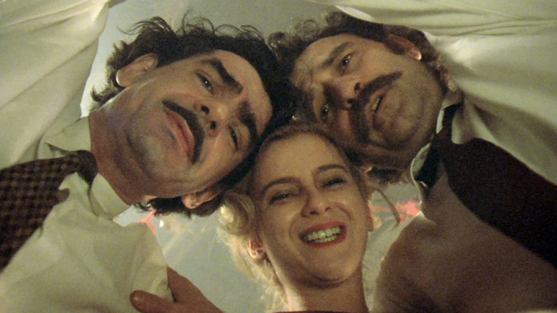 Miki Manojlović as Marko Dren, Mirjana Joković as Natalija Zovkov, and Lazar Ristovski as Petar "Blacky" Popara dancing together in Underground