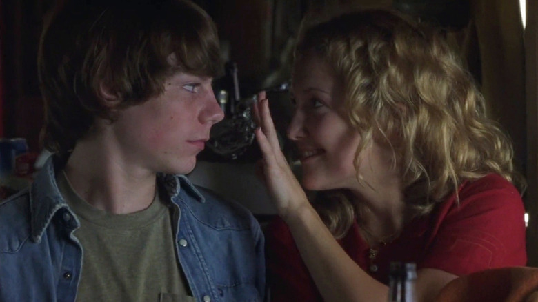 Kate Hudson as Penny Lane waving her hand in front of William (Patrick Fugit) on the bus in Almost Famous
