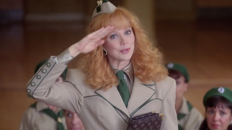 Shelley Long as Phyllis Nefler saluting in her altered Wilderness Girls uniform in Troop Beverly Hills