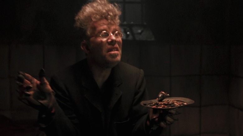 Tom Waits as Renfield holding a plate of bugs in Bram Stoker's Dracula
