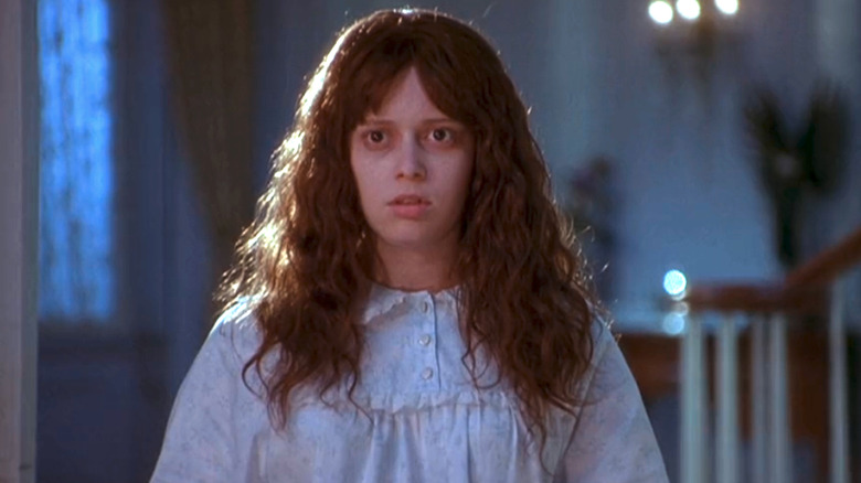 Natasha Lyonne with scary hair and makeup tied to bed in Scary Movie 2