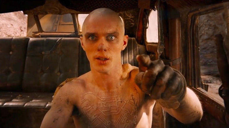 Nicholas Hoult gestures goodbye as Nux in Mad Max: Fury Road.