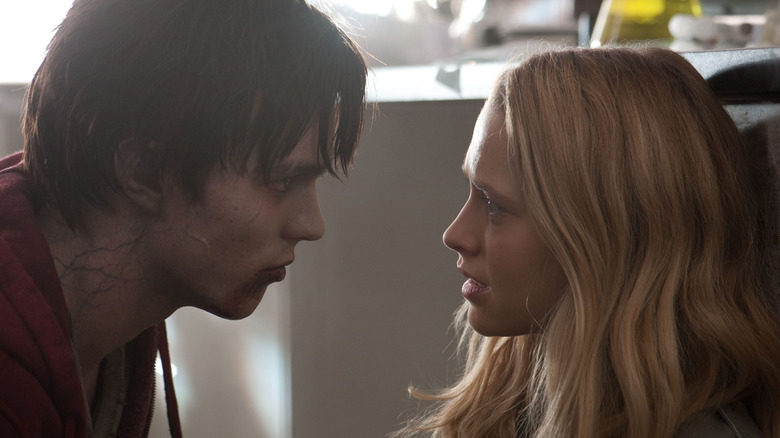 Nicholas Hoult as R stares at Teresa Palmer as Julie in Warm Bodies.