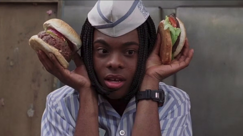 Ed (Kel Mitchell) trying to listen to two cheeseburgers in Good Burger