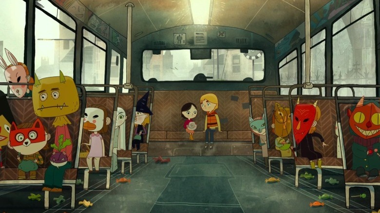 Saoirse and Ben sitting in the back of a bus full of kids in Halloween costumes in Song of the Sea
