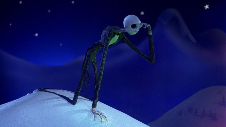 Jack Skellington looking down from a snow hill in The Nightmare Before Christmas