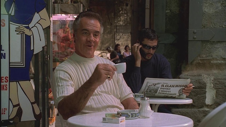 Paulie Waluts raising coffee cup