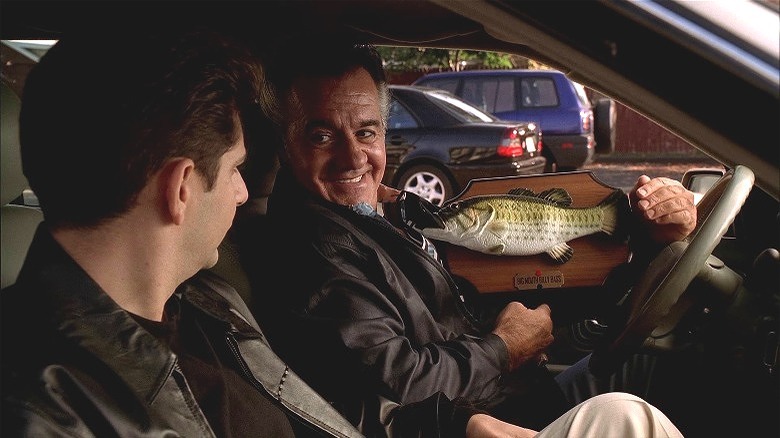 Paulie Walnuts holding toy fish