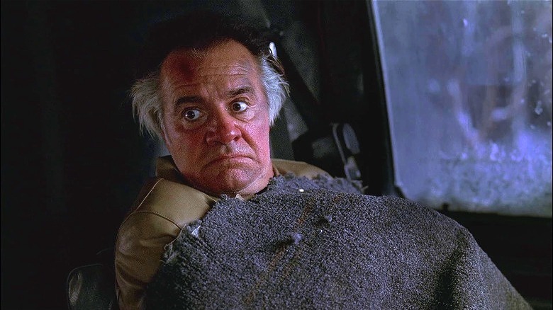 Paulie Walnuts laying under blanket