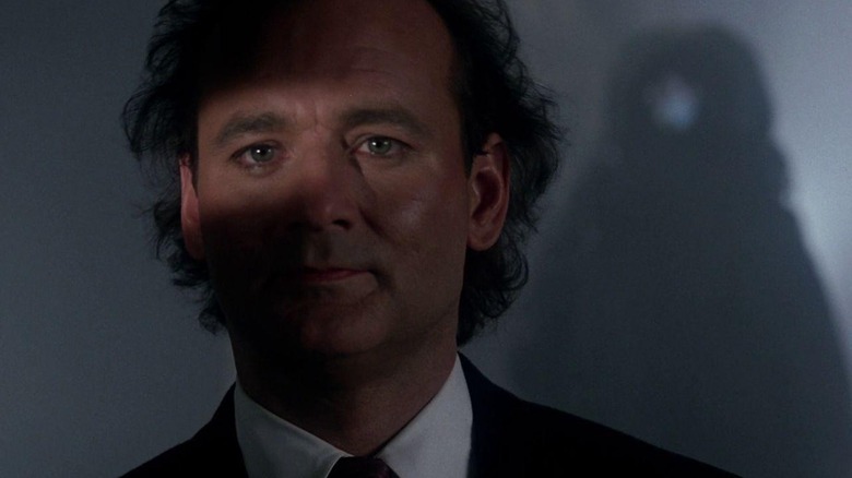 Frank Cross (Bill Murray) is stalked by the Ghost of Christmas Future in Scrooged