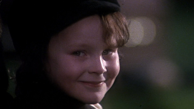 Damien (Harvey Spencer Stephens) smiles in The Omen