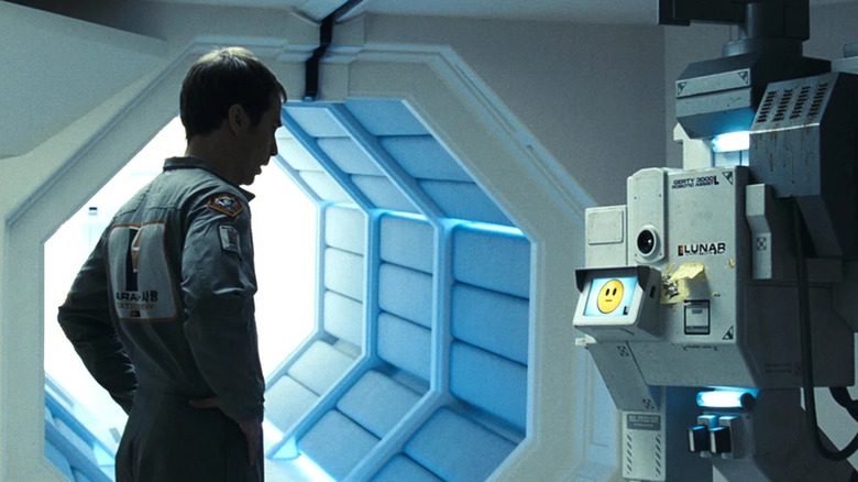 Sam Bell (Sam Rockwell) speaks with an inquisitive machine in Moon (2009)