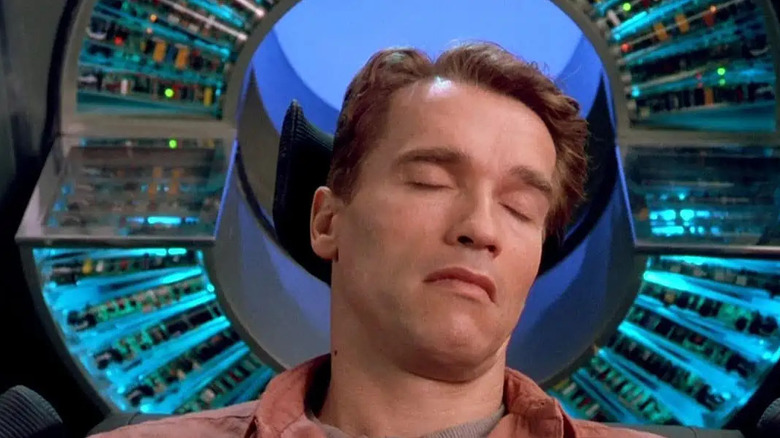 Doug Quaid (Arnold Schwarzenegger) lies unconscious in a memory modifier in Total Recall (1990)