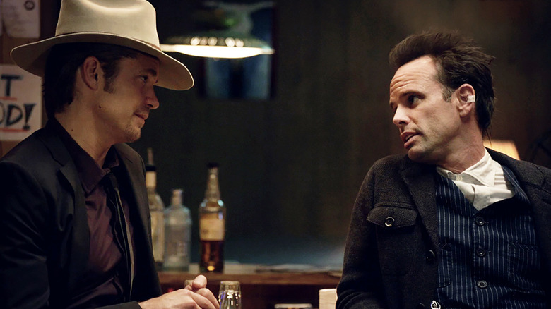 Raylan Givens (Timothy Olyphant) speaks with Boyd Crowder (Walton Goggins) at a bar in Justified