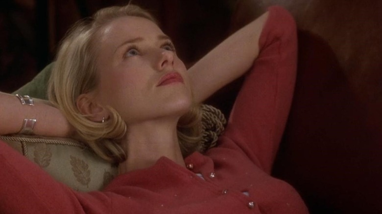 Naomi Watts as Betty Elms in Mulholland Drive, laying with her hands under her head and looking aspirationally up into the sky.