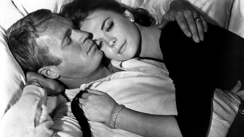 Steve McQueen as Rocky and Natalie Wood as Angie, holding each other in Love with the Proper Stranger