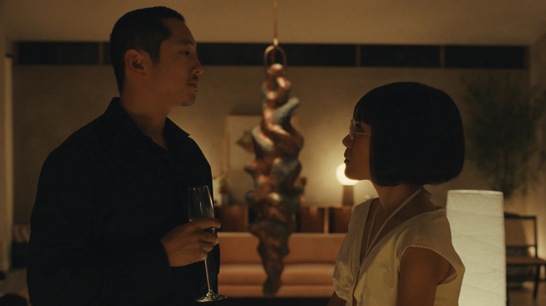 Danny (Steven Yeun) and Amy (Ali Wong) consider each other in Beef.