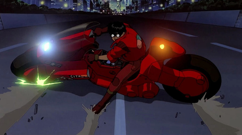 Shotaro Kaneda (Mitsuo Iwata) performing the iconic motorcycle slide in Akira on a desolate highway.