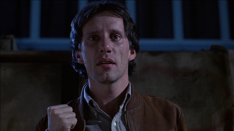 James Woods as Max Renn in Videodrome, looking off at something in the distance.