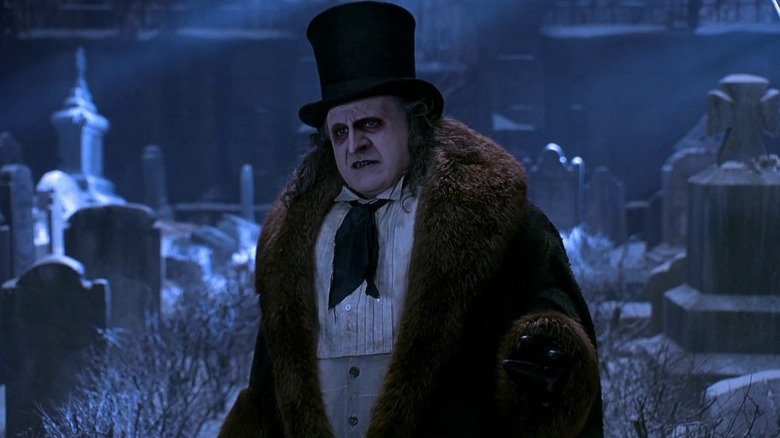 Penguin (Danny DeVito) wearing a top hat in Batman Returns