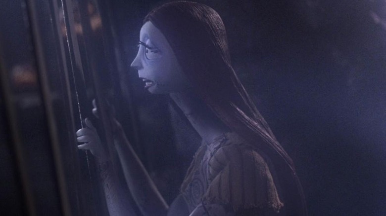 Sally looking through a gate in The Nightmare Before Christmas