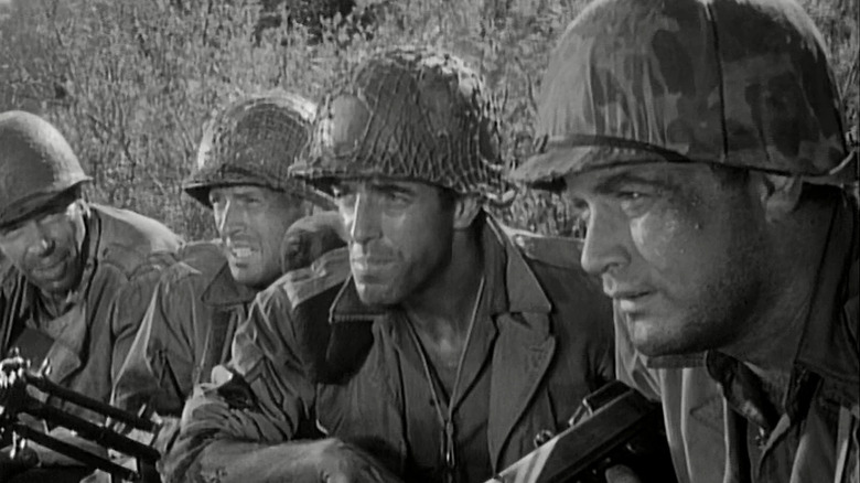 Chip Saunders (Vic Morrow) sits with Littlejohn (Dick Peabody), Kirby (Jack Hogan), and Caje (Pierre Jalbert) in Combat!