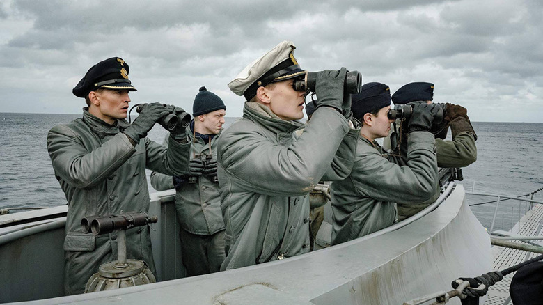 A German U-boat crew looks through binoculars from their submarine in Das Boot