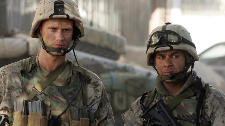 Staff Sergeant Brad Colbert (Alexander Skarsgård) stands next to Sergeant Antonio Espera (Jon Huertas) in Generation Kill
