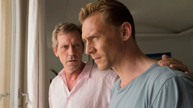 Hugh Laurie as Richard Roper putting hand on shoulder of Tom Hiddleston as Jonathan Pine in The Night Manager