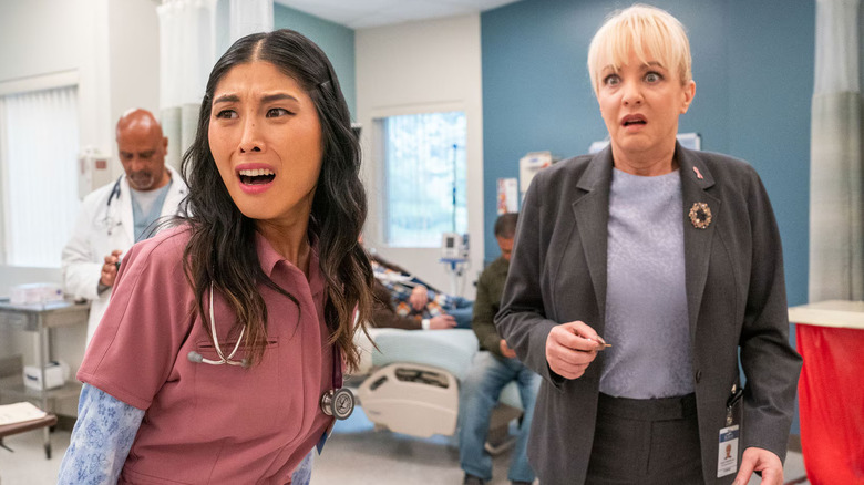 Kahyun Kim and Wendi McLendon-Covey as Serena and Joyce looking concerned in St. Denis Medical