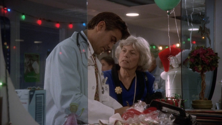 Dr. Doug Ross (George Clooney) signing medical forms on ER