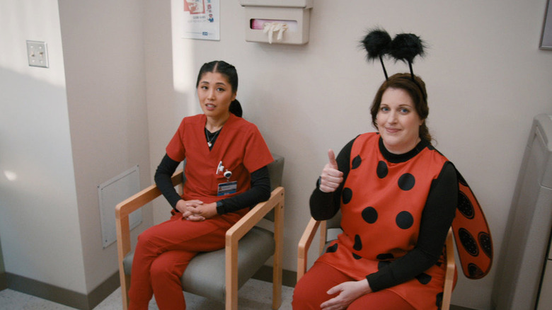 Alex (Allison Tolman) giving a thumbs-up in a ladybug costume on St. Denis Medical