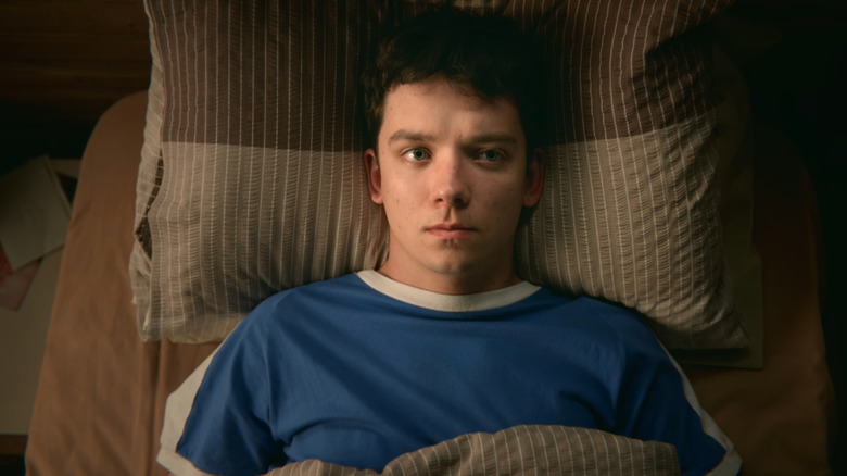 Otis (Asa Butterfield) lying on bed in Sex Education
