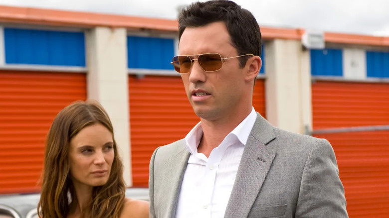 Fiona Glenanne (Gabrielle Anwar) and Michael Westen (Jeffrey Donovan) stand by storage units in Burn Notice
